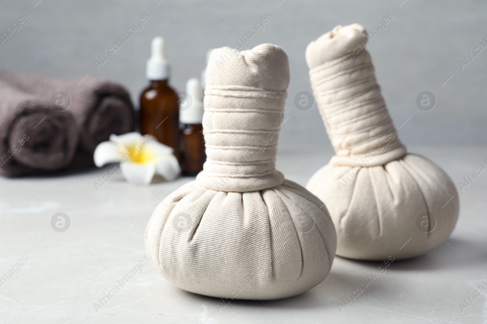 Photo of Herbal bags for spa massage on table