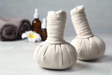 Herbal bags for spa massage on table