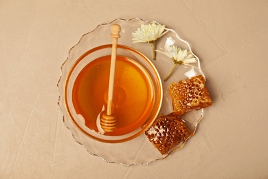 Photo of Flat lay composition with bowlhoney and dipper on color background