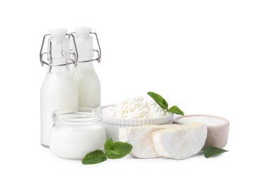 Photo of Different fresh dairy products and mint isolated on white