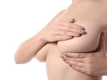 Photo of Woman checking her breast on white background, closeup