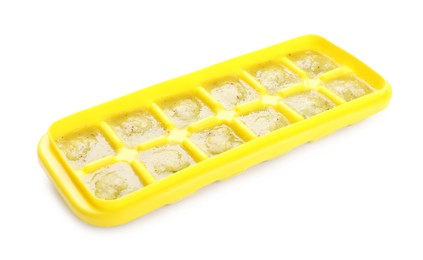 Photo of Puree in ice cube tray on white background. Ready for freezing