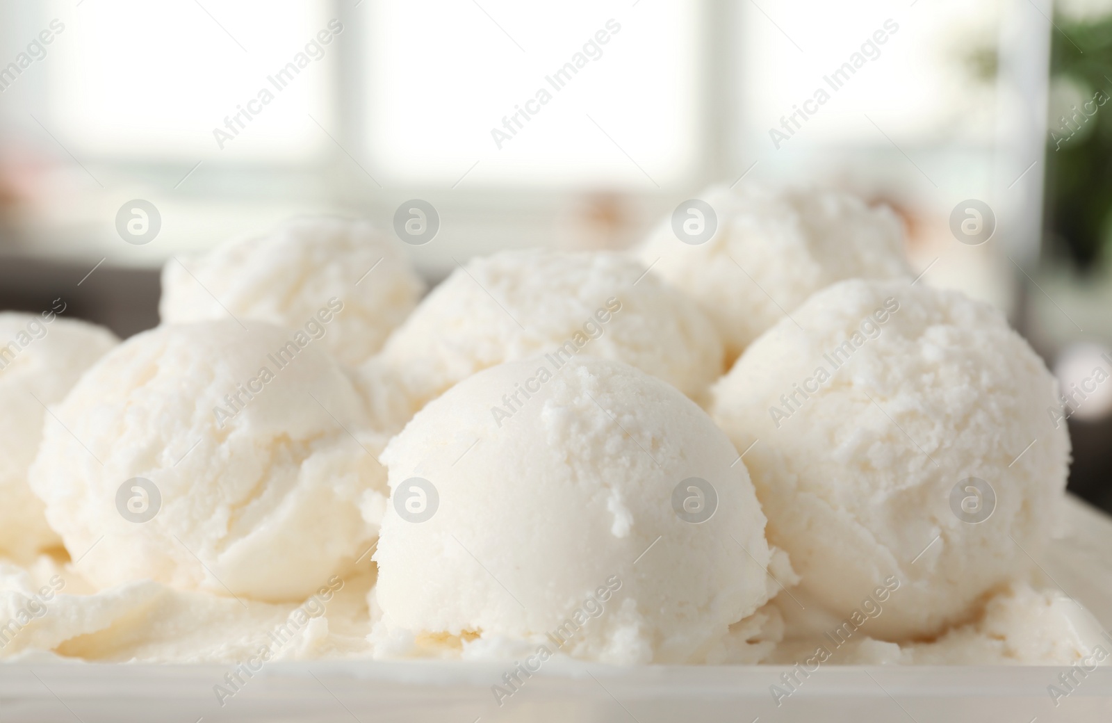 Photo of Plate with tasty vanilla ice cream, closeup