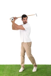 Young man playing golf on white background