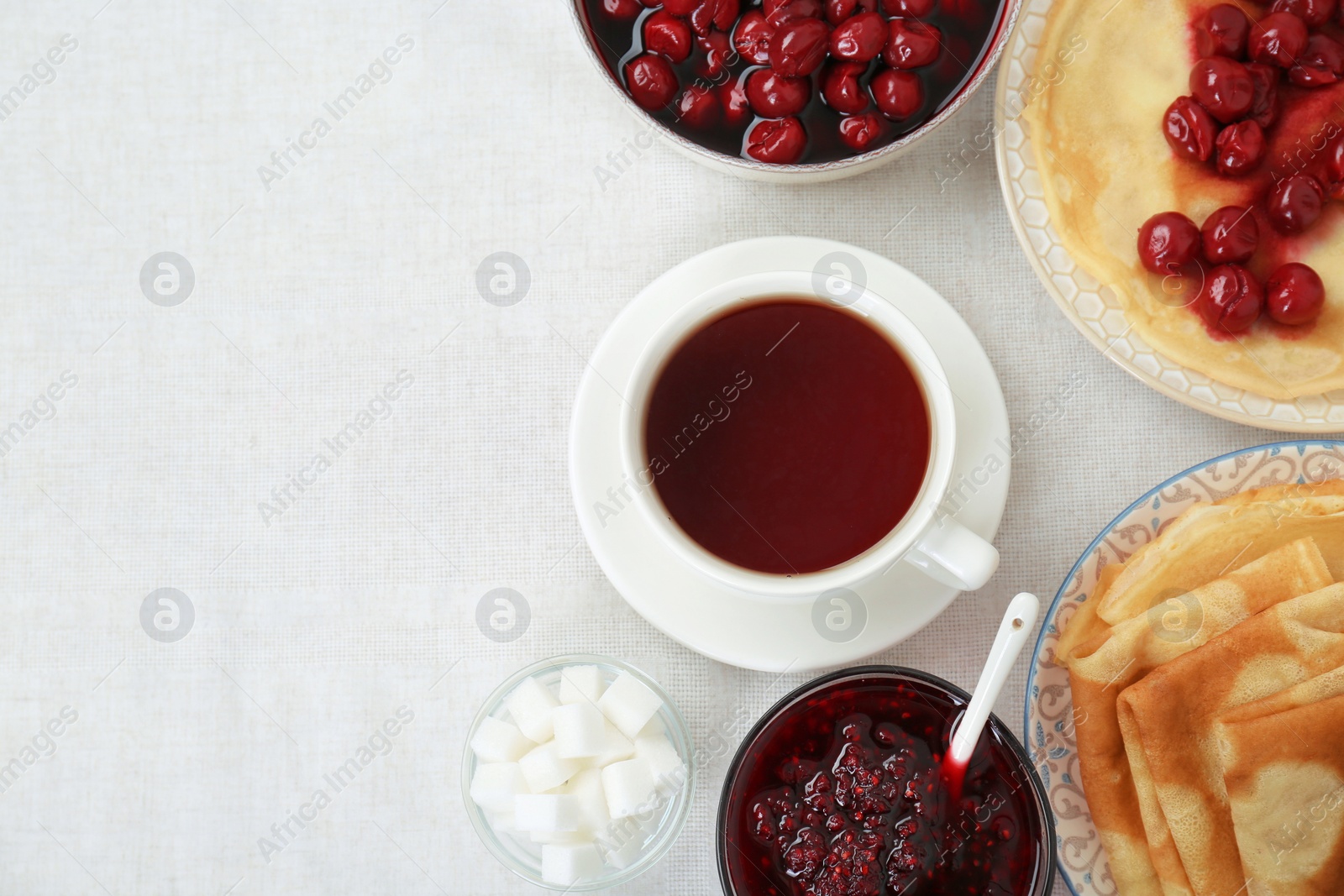 Photo of Cup of hot drink and snacks on table, flat lay with space for text. Traditional Russian tea ceremony