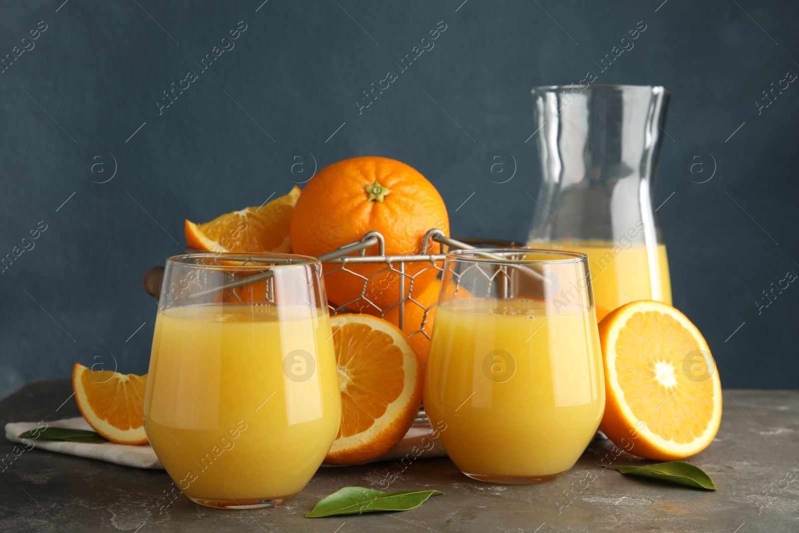 Photo of Composition with orange juice and fresh fruit on table