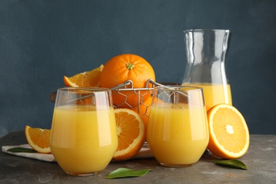 Photo of Composition with orange juice and fresh fruit on table