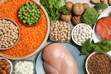 Photo of Different products rich in protein on table, flat lay