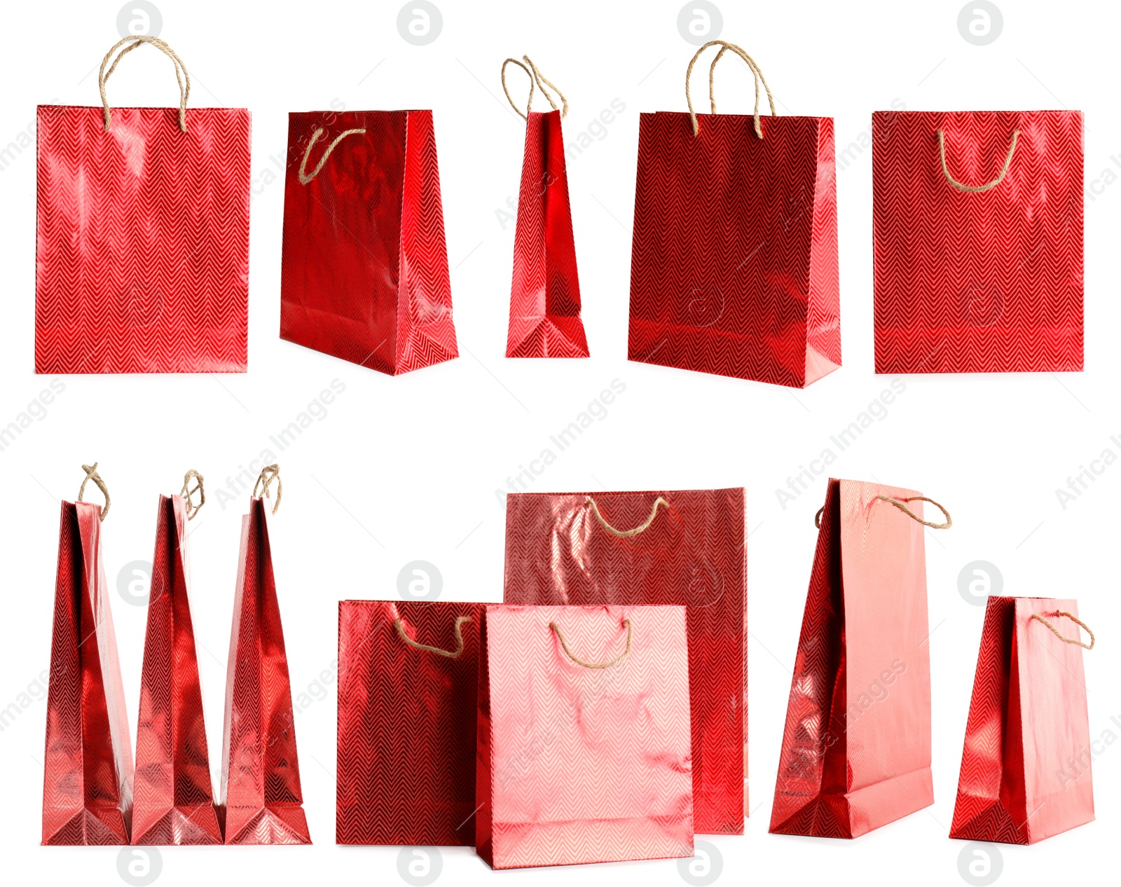 Image of Set of paper shopping bags on white background