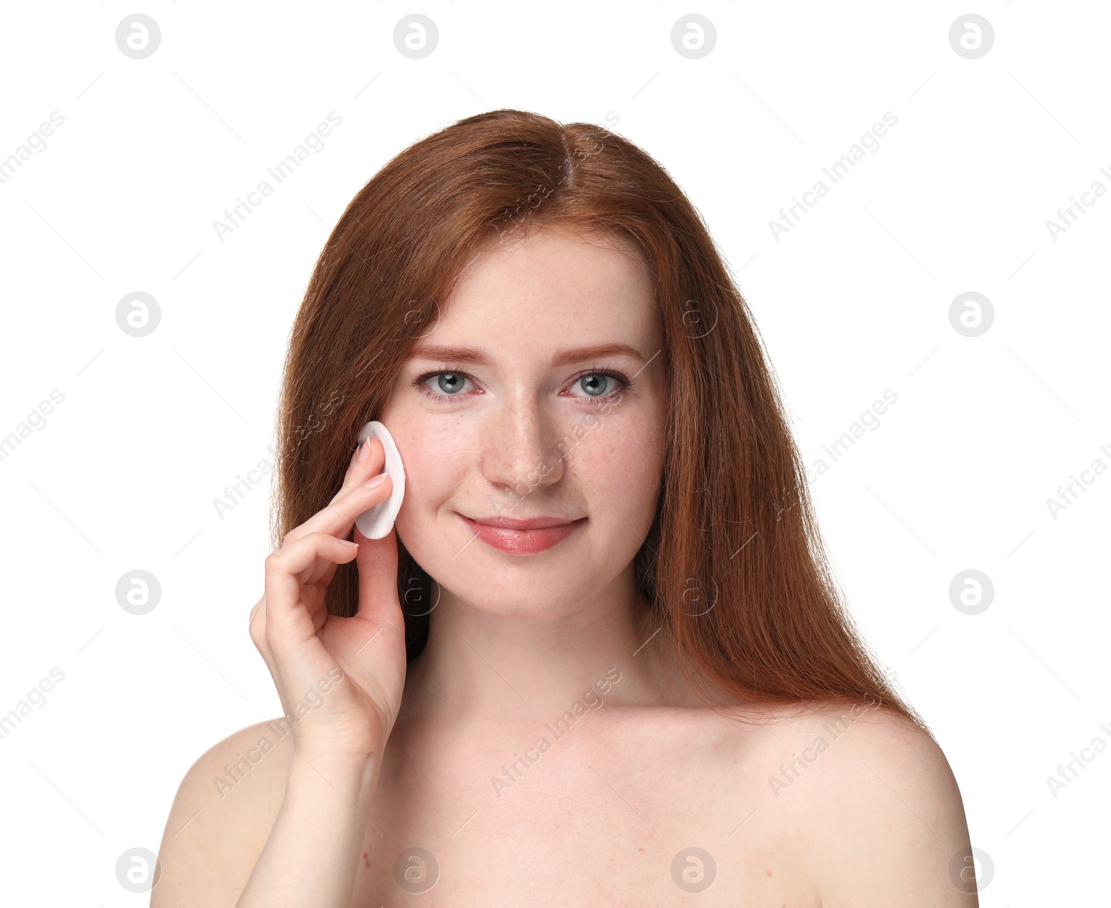 Photo of Beautiful woman with freckles wiping face on white background