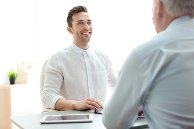 Photo of Human resources manager conducting job interview with applicant in office