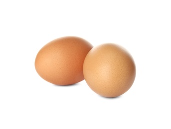 Raw brown chicken eggs on white background