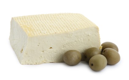 Piece of delicious tofu and olives on white background. Soybean curd