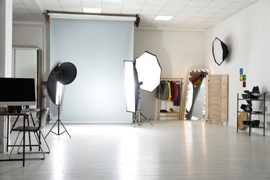 Interior of modern photo studio with professional equipment