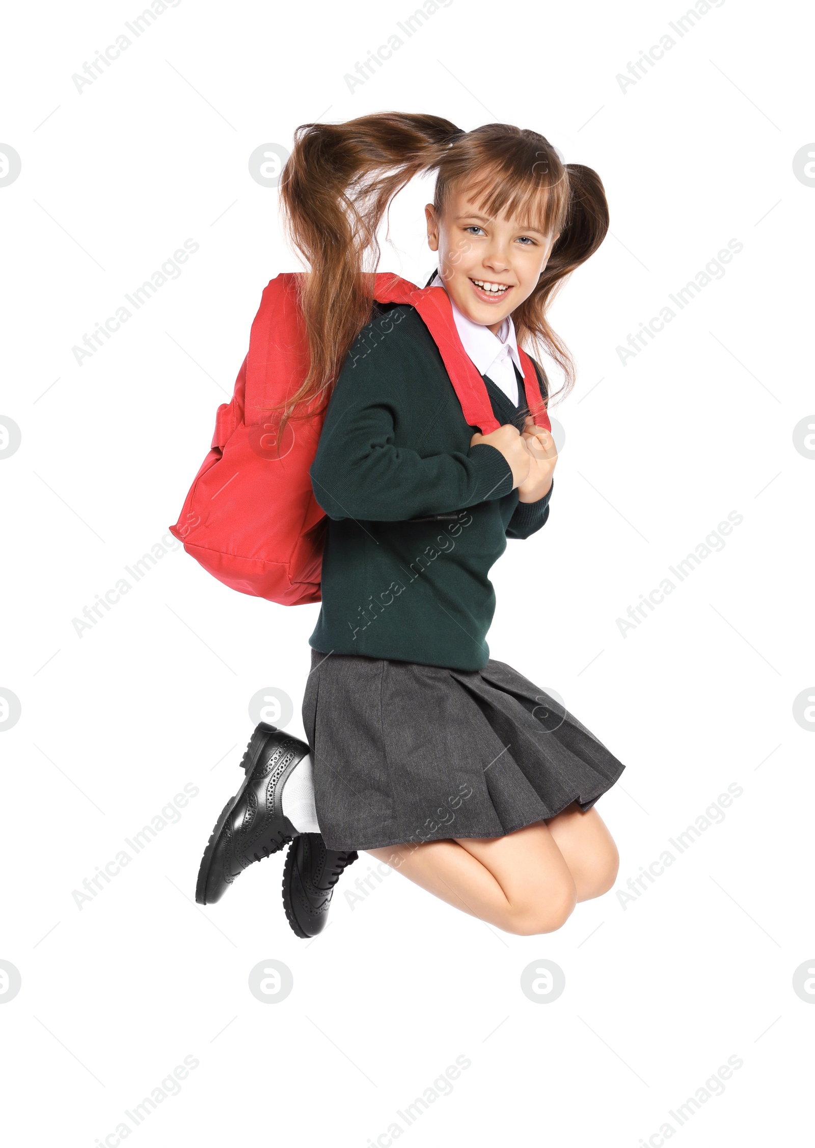 Photo of Little girl in stylish school uniform on white background