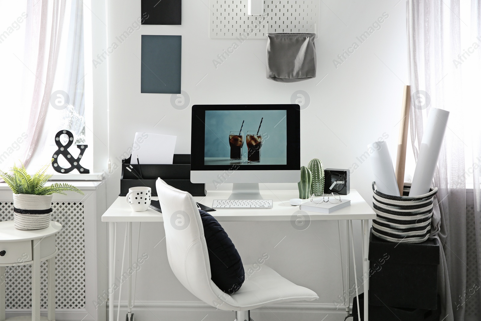 Photo of Comfortable workplace with computer on desk in home office