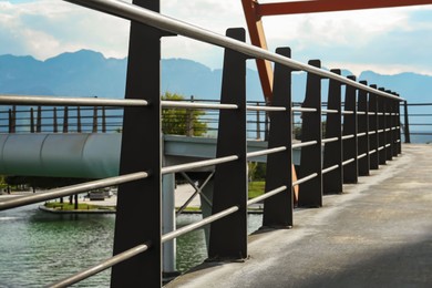 Photo of Metal handrails of bridge over canal outdoors