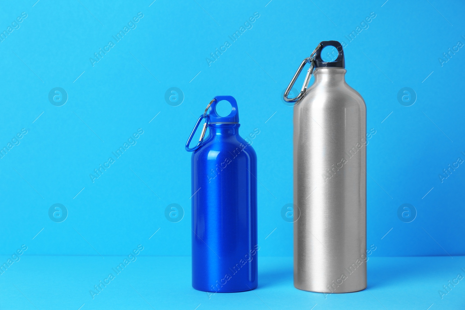 Photo of Sport bottles with space for text on color background