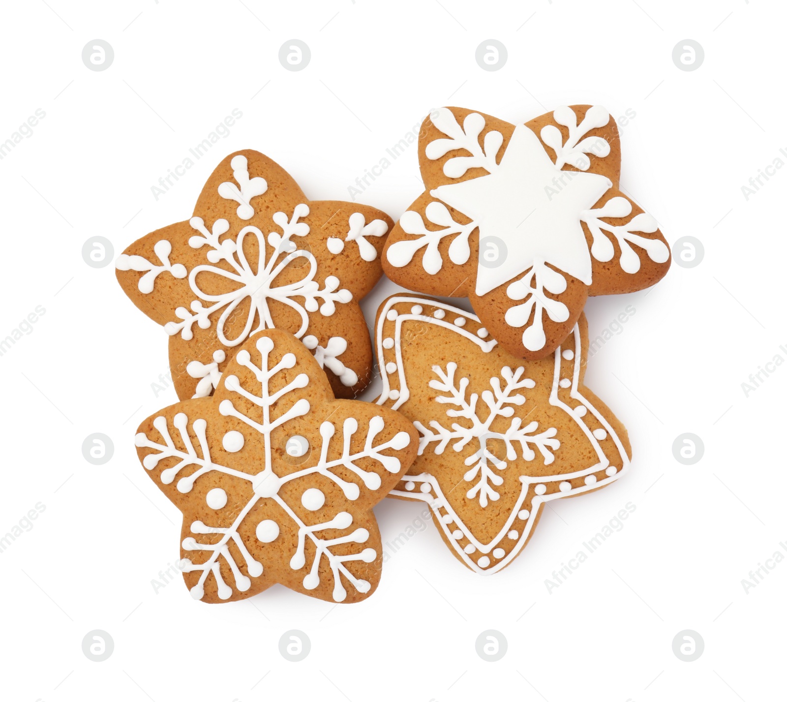 Photo of Tasty star shaped Christmas cookies with icing isolated on white, top view