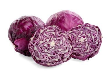 Whole and cut red cabbages on white background