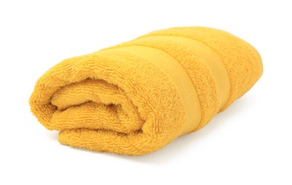 Photo of Rolled yellow terry towel isolated on white