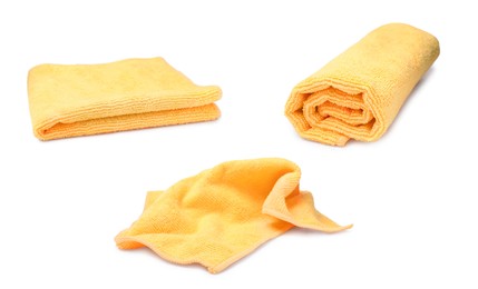 Image of Set with yellow microfiber cloths on white background