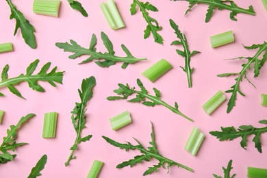 Photo of Flat lay composition with fresh ingredients for salad on pink background