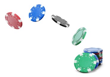 Image of Different casino chips falling on white background