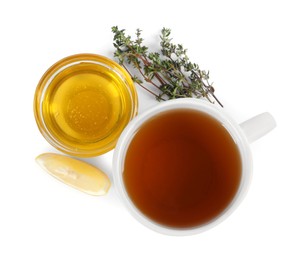 Aromatic herbal tea with thyme, honey and lemons isolated on white, top view