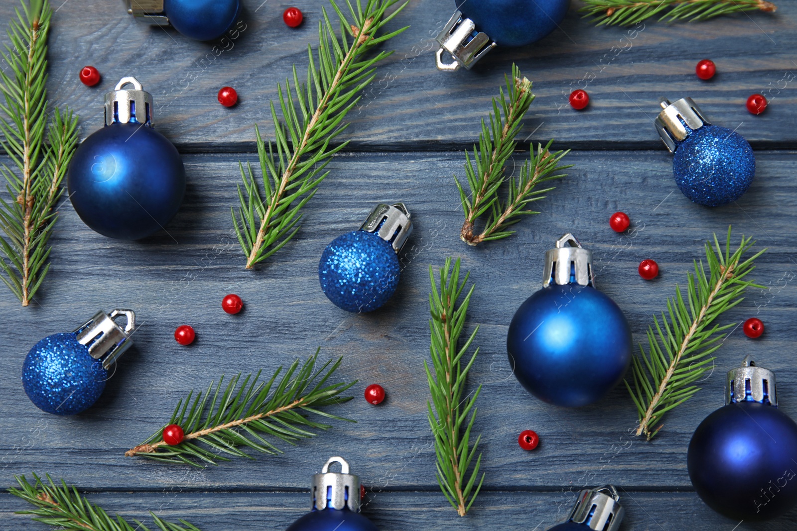 Photo of Flat lay composition with Christmas decor on blue wooden background