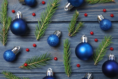 Flat lay composition with Christmas decor on blue wooden background