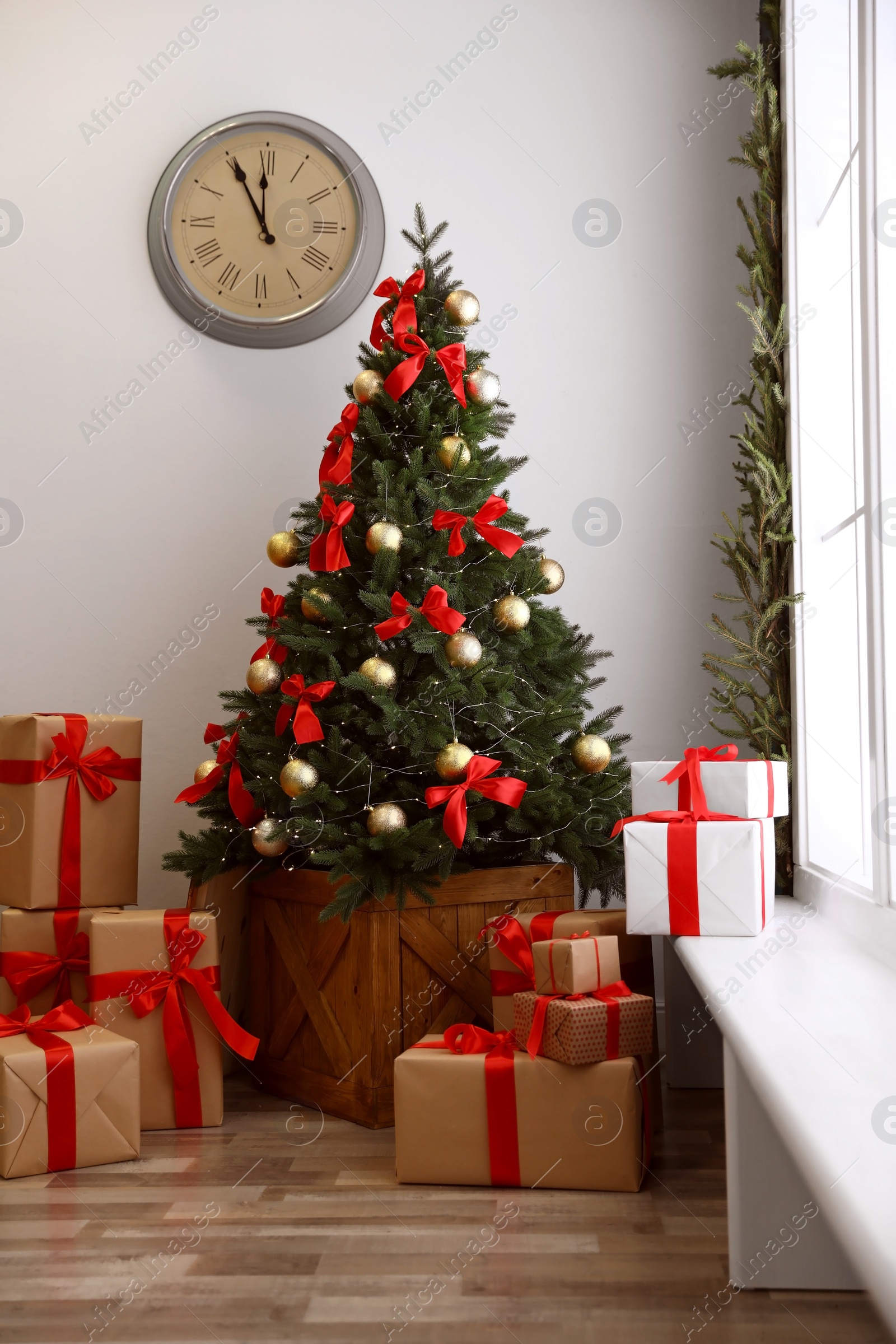Photo of Decorated Christmas tree with gifts. Festive interior
