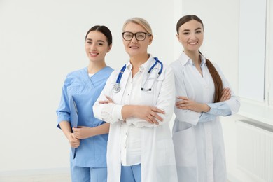 Portrait of medical doctors wearing uniforms indoors