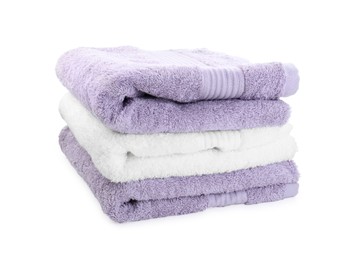 Photo of Stack of different folded terry towels isolated on white