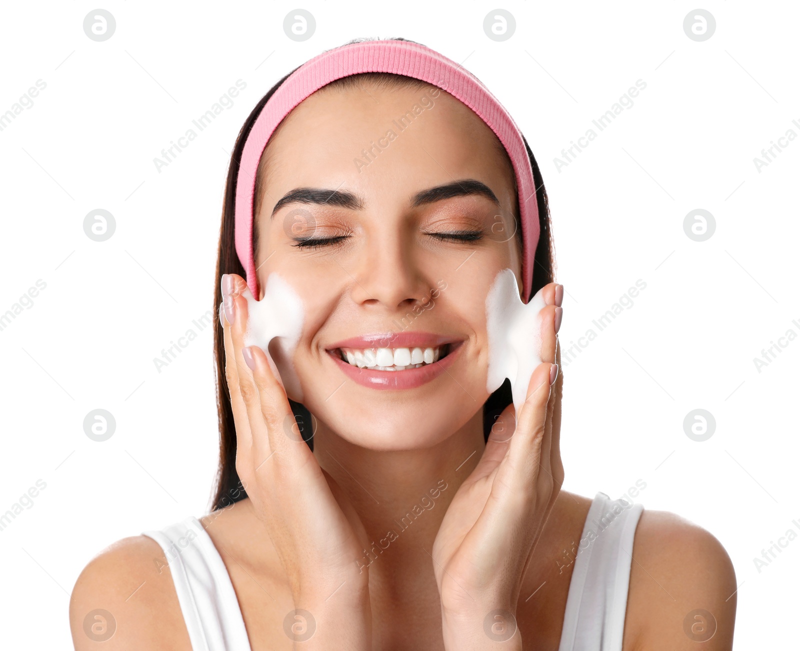 Photo of Young woman applying cosmetic product on white background. Washing routine