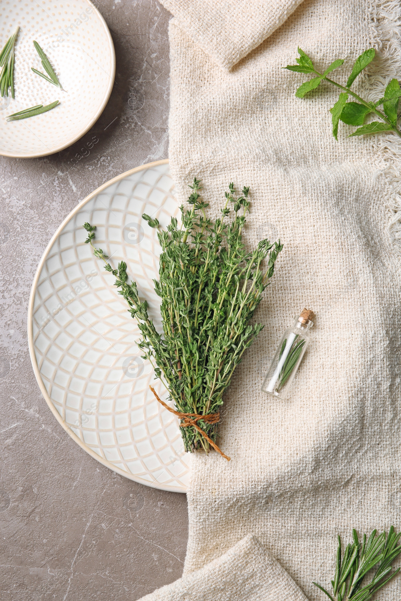 Photo of Flat lay composition with thyme, rosemary and mint on table. Aromatic herbs