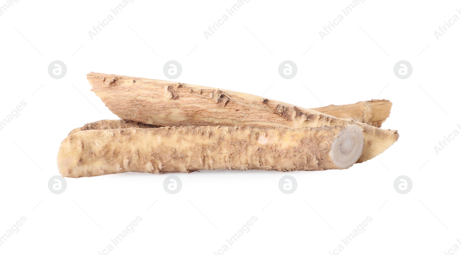Photo of Fresh cut horseradish roots isolated on white
