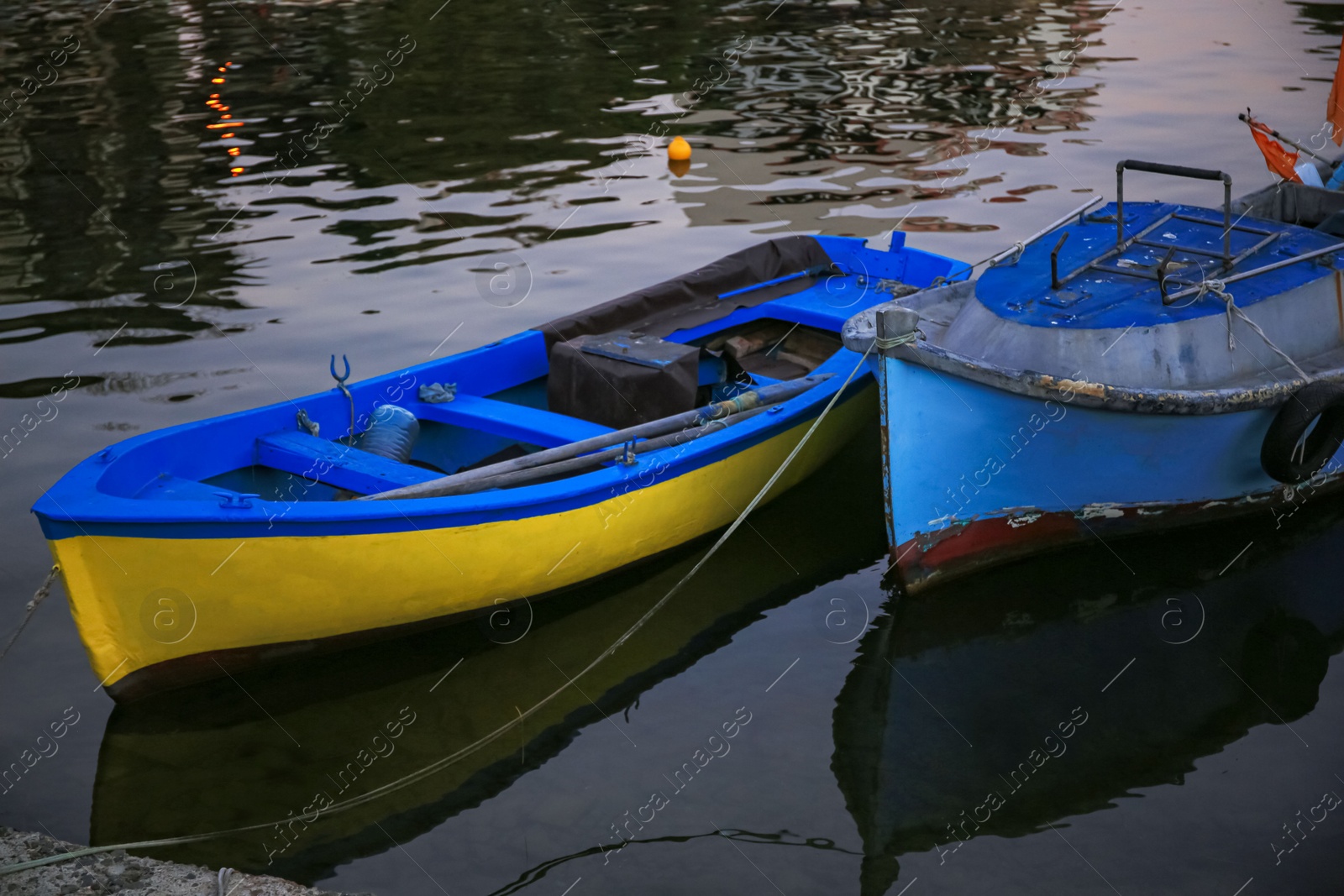 Photo of Beautiful view of river with moored boats at sunset