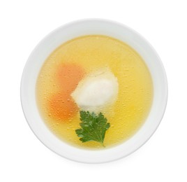 Delicious chicken bouillon with carrot and parsley in bowl on white background, top view