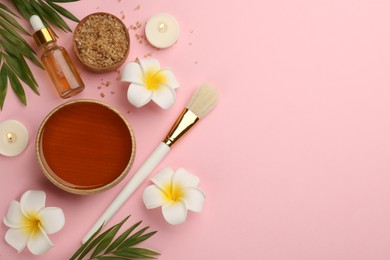 Photo of Flat lay composition with cosmetic product on light pink background, space for text. Spa body wraps