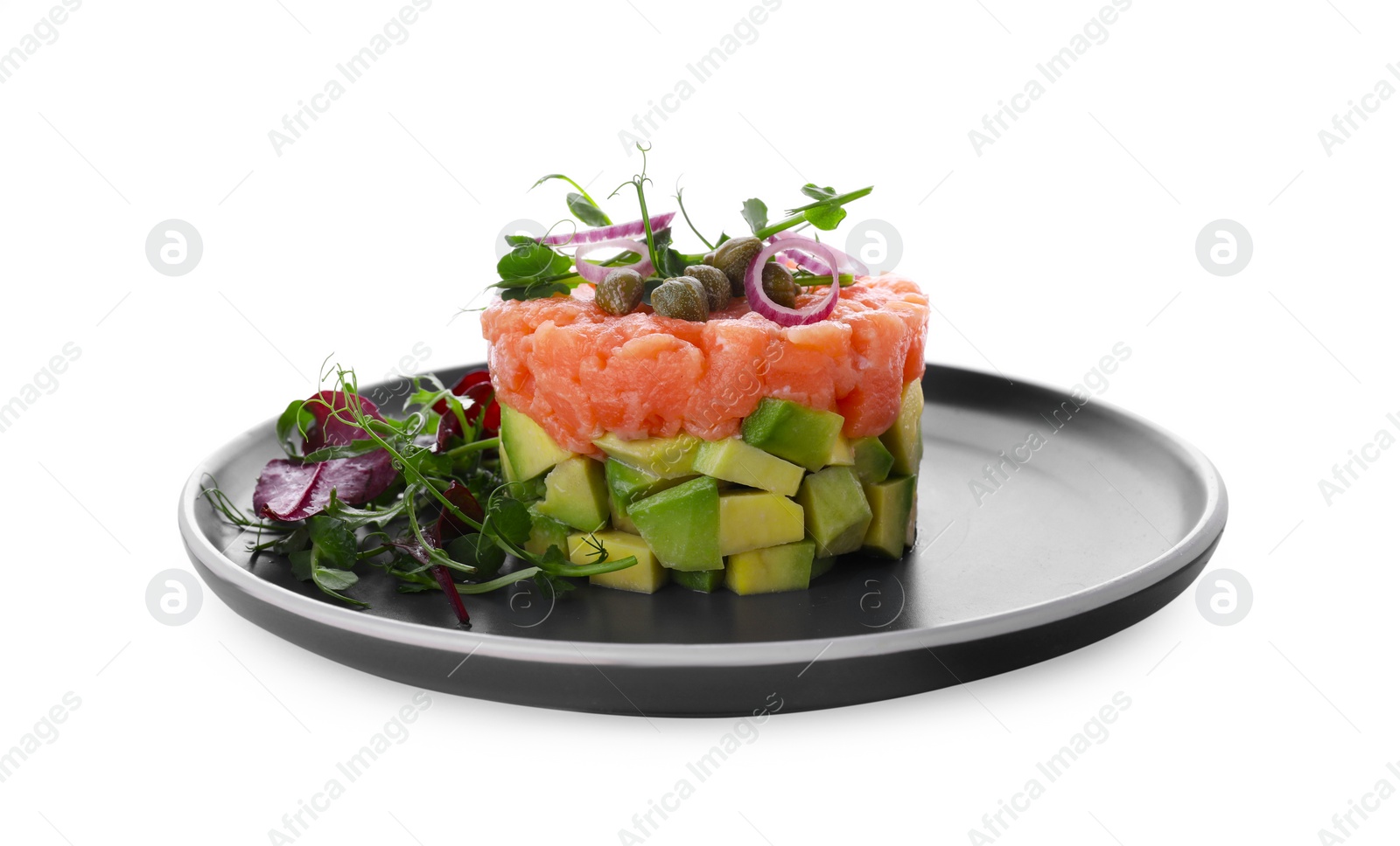 Photo of Tasty salmon tartare with avocado and greens isolated on white