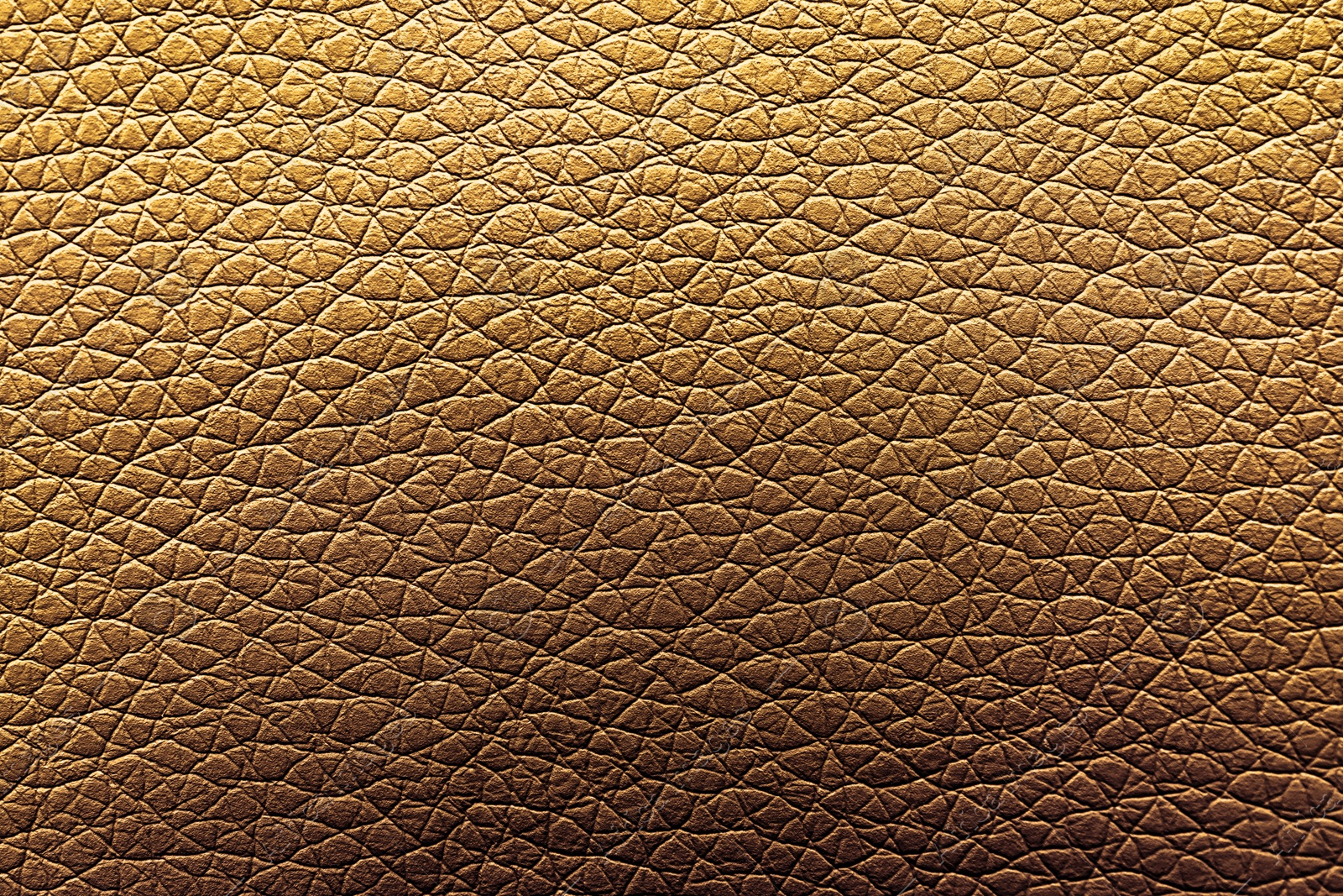 Image of Golden textured surface as background, closeup view