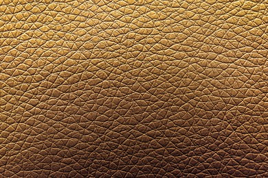 Image of Golden textured surface as background, closeup view