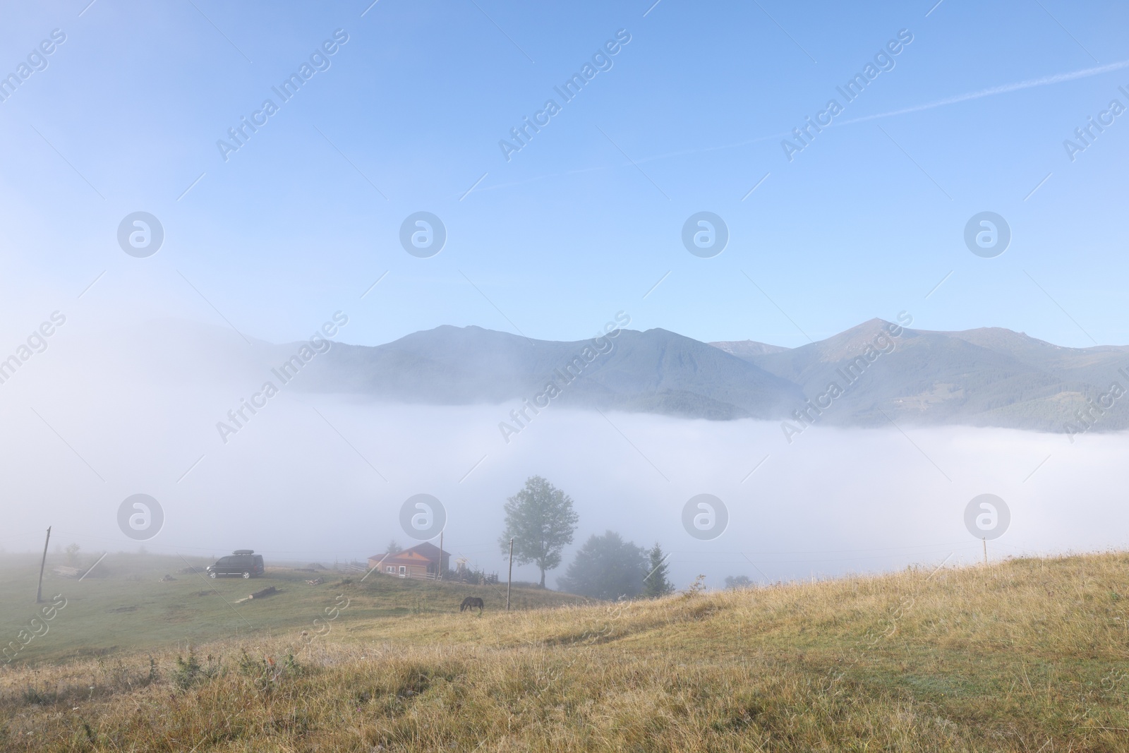 Photo of Beautiful view of landscape with foggy mountain hills