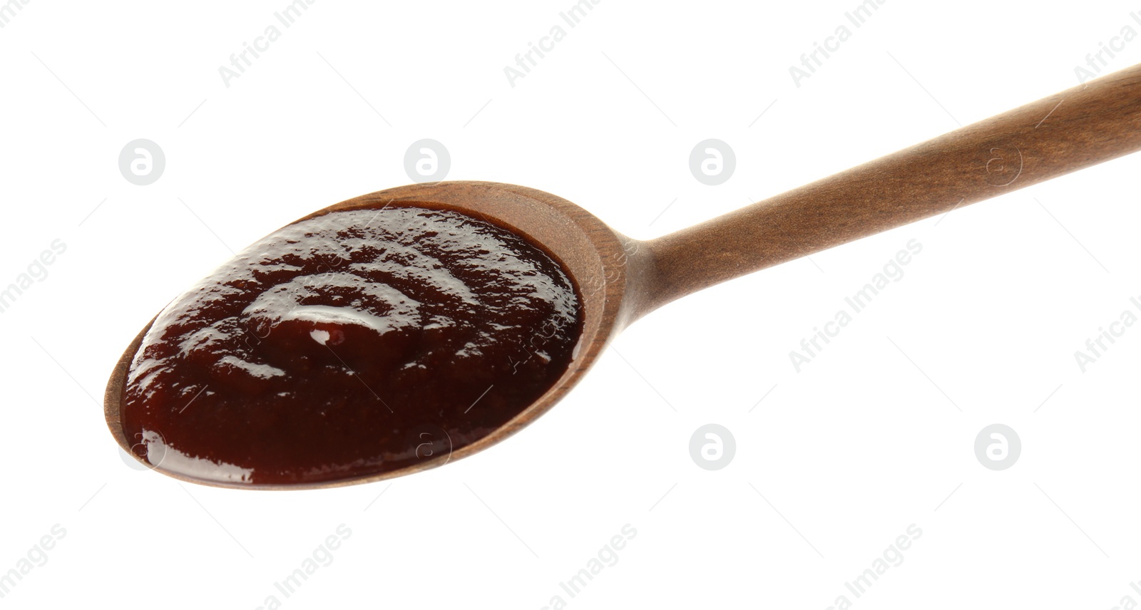 Photo of Spoon with hot barbecue sauce on white background