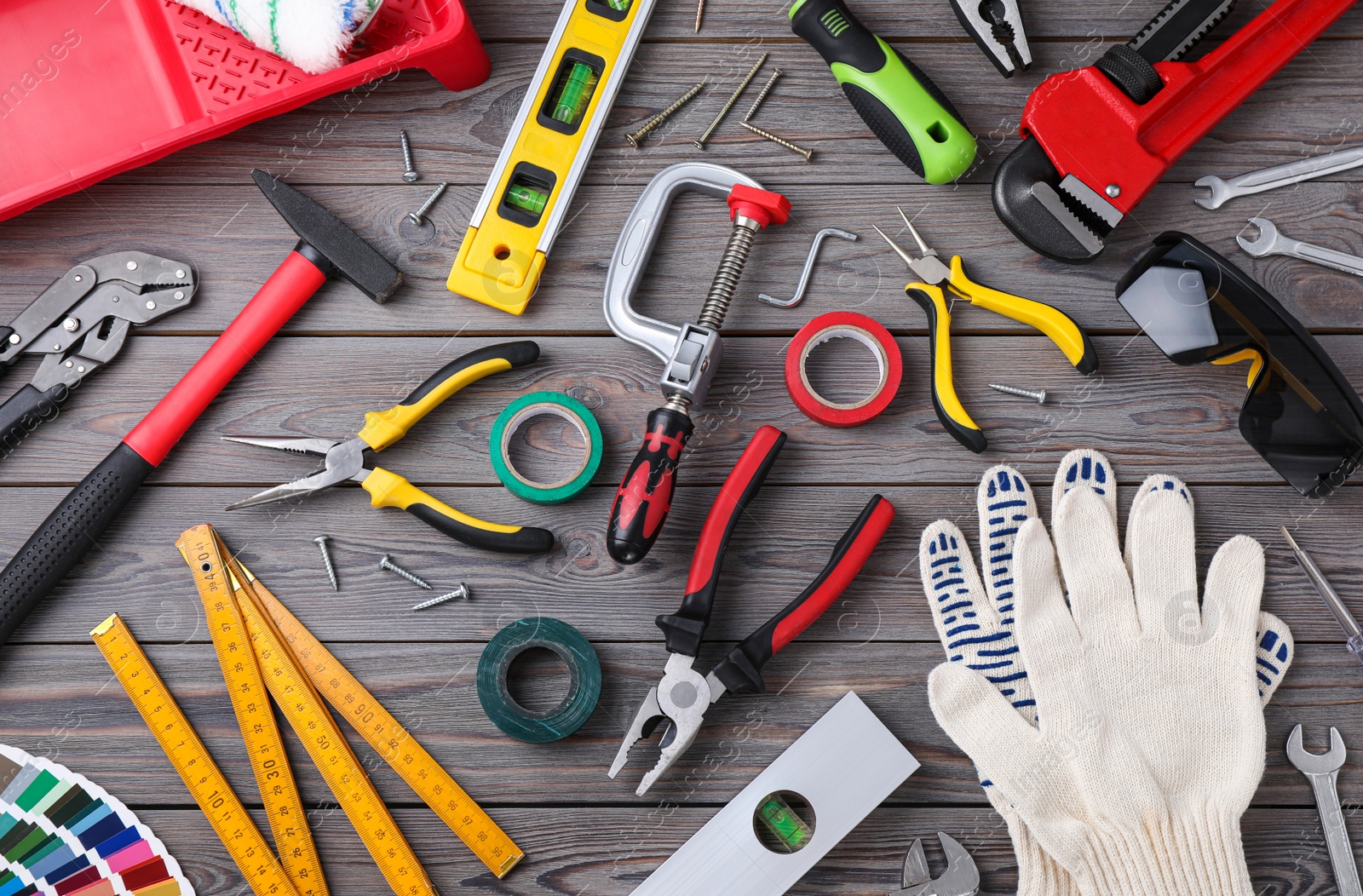 Photo of Flat lay composition with different construction tools on wooden background