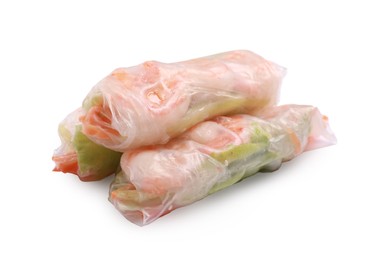 Photo of Tasty spring rolls with shrimps, carrot and lettuce on white background