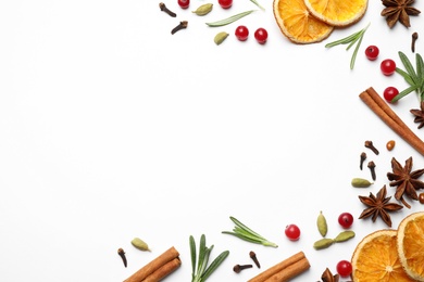 Photo of Different mulled wine ingredients on white background, flat lay. Space for text