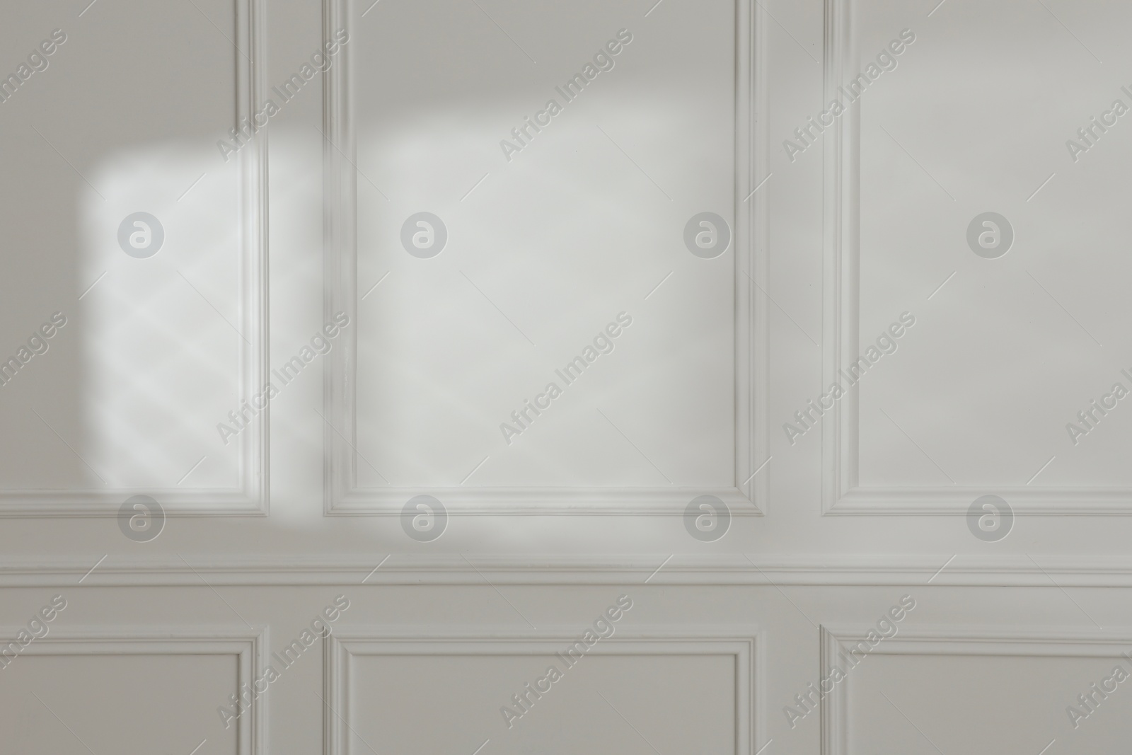 Photo of Light and shadow from window on white wall