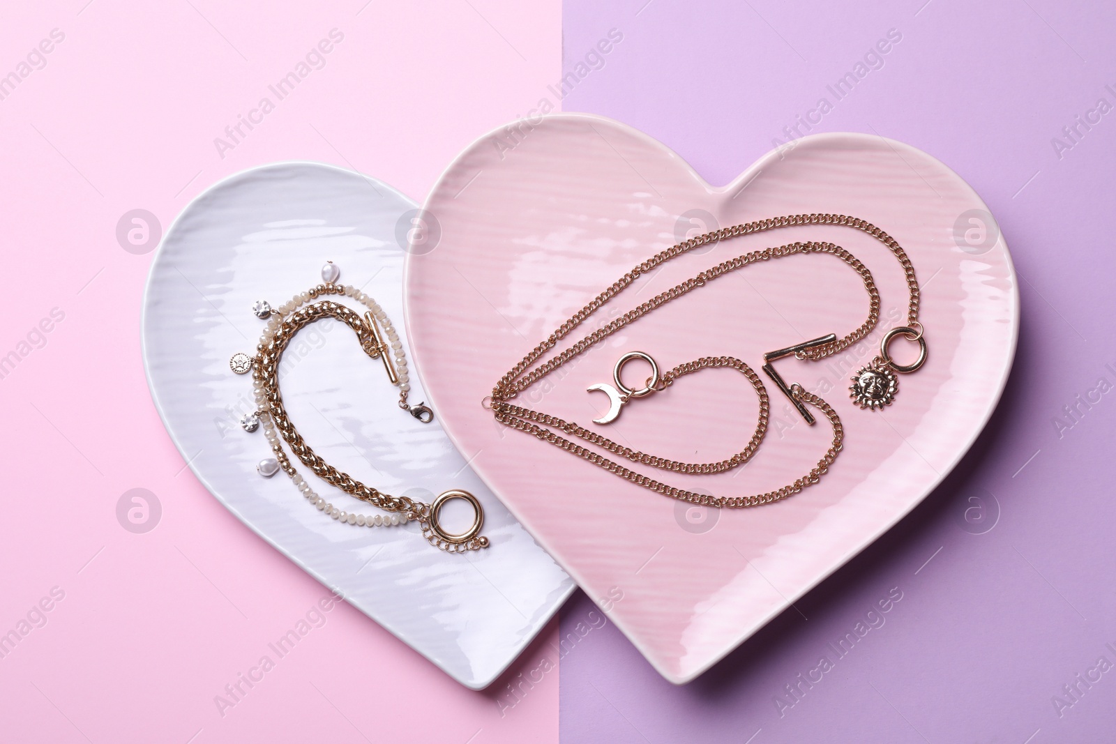 Photo of Beautiful jewelry on color background, flat lay